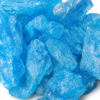 Vibrant sky blue crystalline pieces arranged on a clean white surface
